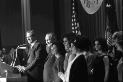 Pres. Lyndon B. Johnson and family, Texas Gov. John Connally, on stage at a celebration of the presidential election results